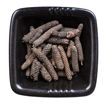 Top view of java long pepper in bowl isolated Photos