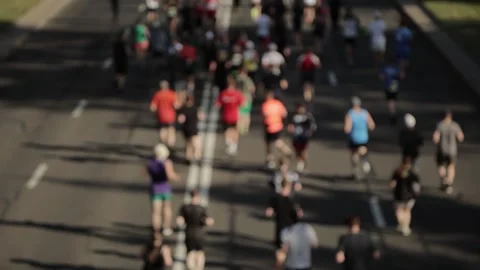 Top view. Joggers. Group of marathon runners. Abstract blurry Stock Footage 253206911