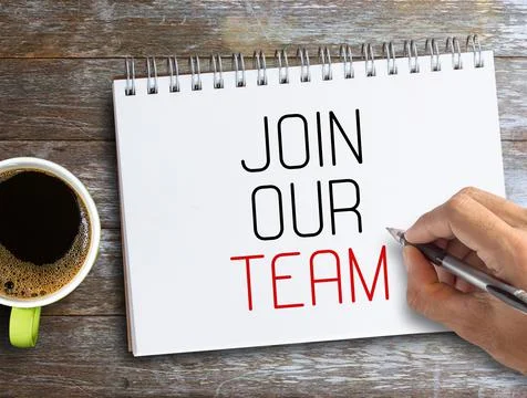 Top view with join our team text in notebook,pencil,keyboard and coffee on wo Stock Photos