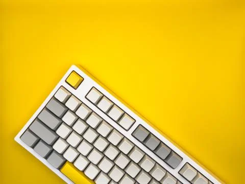 A top view of keyboard without letters on an empty yellow space on a background Stock Photos