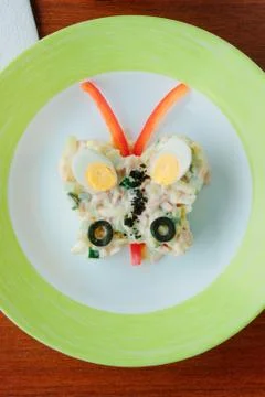 Top view of kid salad in a form of butterfly. Stock Photos