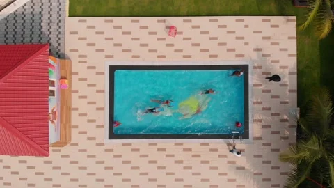 Top view of kids shallow pool with kids playing and swimming.  스톡 동영상 149932819