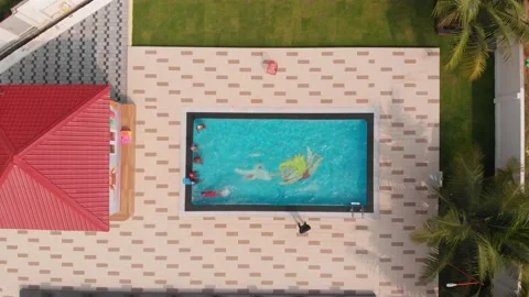 Top view of kids shallow pool with kids playing and swimming.  스톡 동영상 149933006