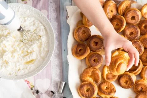 Top view of kitchen table preparation of pastry filled with cream Stock Photos