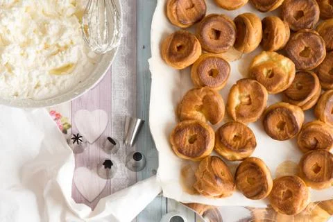 Top view of kitchen table preparation of pastry filled with cream Stock Photos