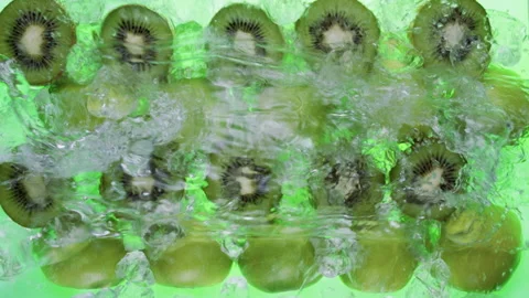 Top View of Kiwi and Apple Halves with Ice,  Water Splashes Stock Footage 310183486