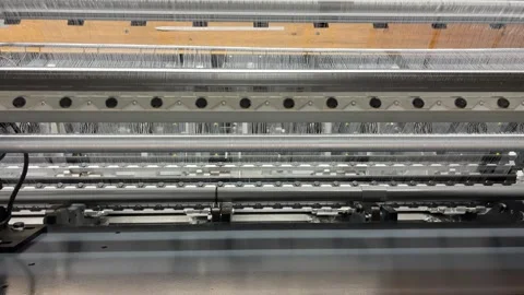 Top view of a knitting machine full of thin threads while knitting fabric Stock Footage 274790034