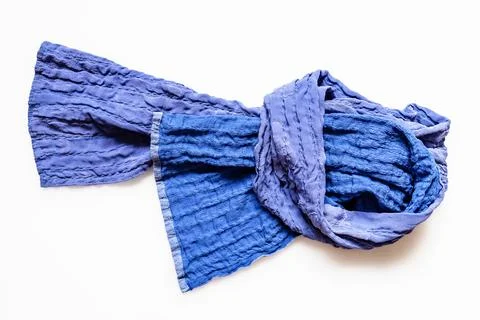 Top view of knotted blue patchwork scarf on white Stock Photos