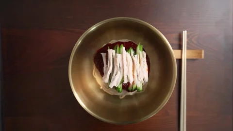 Top View of Korean Cold Noodles Being Prepared in Kitchen 動画素材 334923958