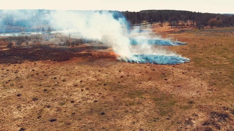 Top view of the land burning along the road Stock Footage 93133460