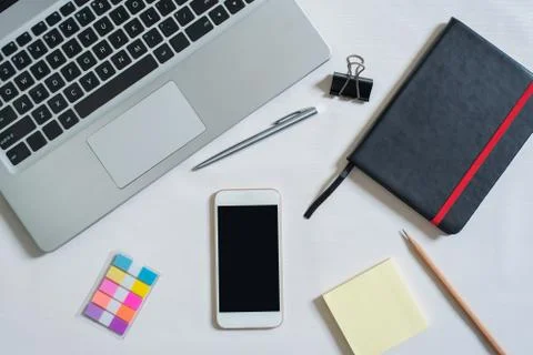 Top view of laptop, black notebook, mini colorful paper note, cellphone, pen, Stock Photos