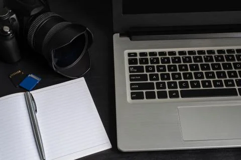 Top view laptop, camera, notebook, pen, memory card Stock Photos