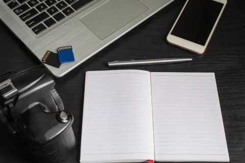 Top view laptop, camera, smartphone, notebook, pen, memory card Stock Photos
