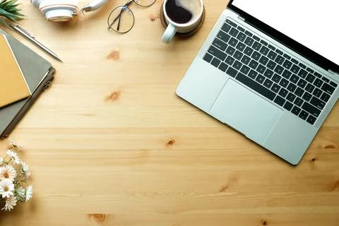 Top view laptop computer, glasses and coffee cup on wooden table.. Stock-Fotos