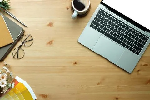 Top view laptop computer, glasses and coffee cup on wooden table. Stock Photos
