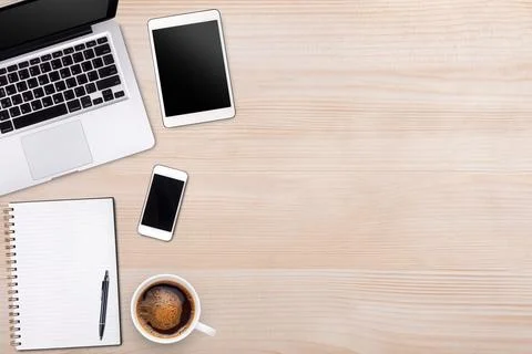 Top view laptop computer or notebook,mobile phone and cup of latte art coff.. Stock Photos