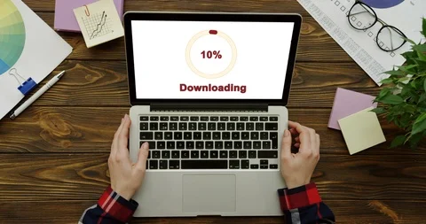 Top view on the laptop computer processing an installation of the program on the Stock Footage 95050705