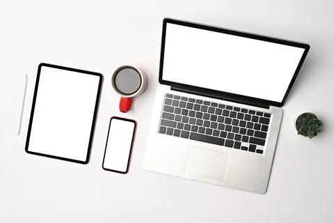 Top view laptop computer, smart phone and digital tablet on white background. Stock Photos