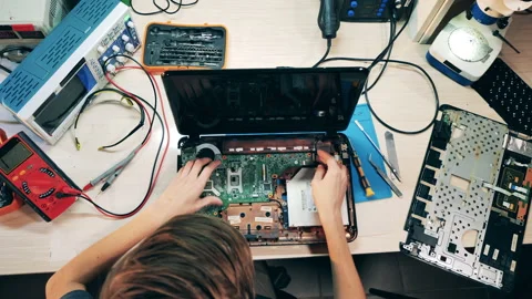 Top view of a laptop getting repaired by an engineer Stock Footage 145540883
