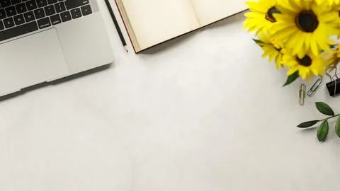 Top view of laptop with notebook and pencil aside sunflowers and binder cli.. Stock Illustration