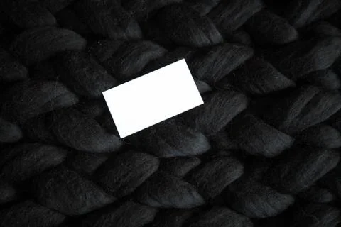 Top view on laptop with notebook and pen on black knitted plaid Stock Photos