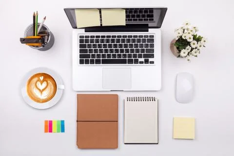 Top view laptop or notebook workspace office and latte coffee on white table Stock Photos