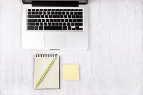 Top view laptop or notebook workspace office on white table. Stock Photos