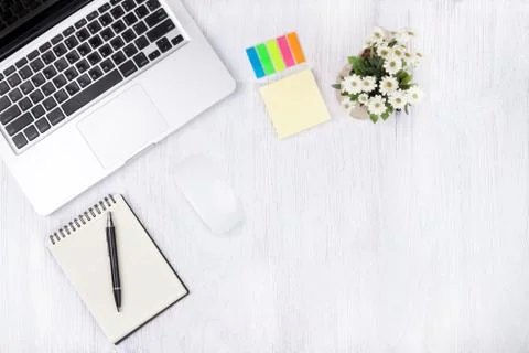 Top view laptop or notebook workspace office on white table. Stock Photos