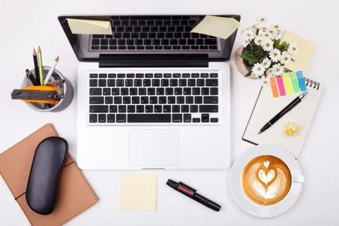 Top view laptop or notebook workspace office and latte coffee on white table 写真素材