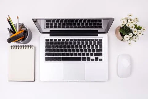 Top view laptop or notebook workspace office on white table. Stock Photos