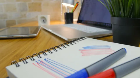 Top view of laptop with sketches Stock Footage 60257140