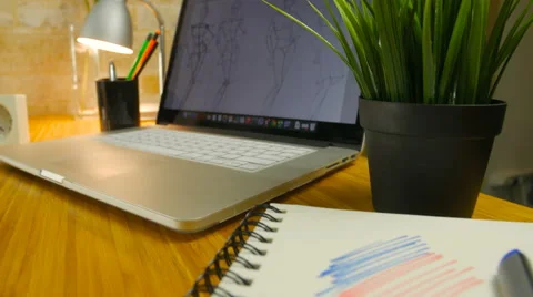 Top view of laptop with sketches Stock Footage 60257154