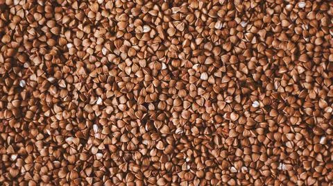 Top view of a large amount of buckwheat groats, prepared for cooking a side d Stock Photos