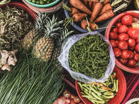 Top view on a large assortment of row loose vegetables and fruit Fotos Stock