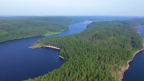 Top view of a large blue lake and islands covered with green coniferous forest. Stock Footage 235527316