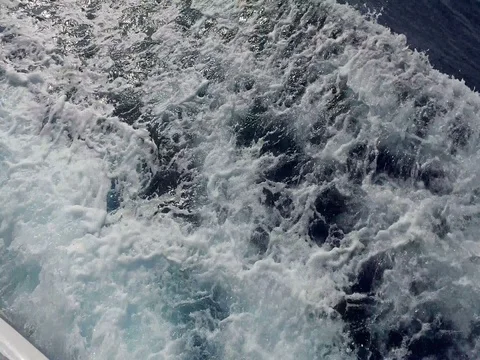 Top view of large boat propellers churning the sea into waves and foam Stock Footage 80053364