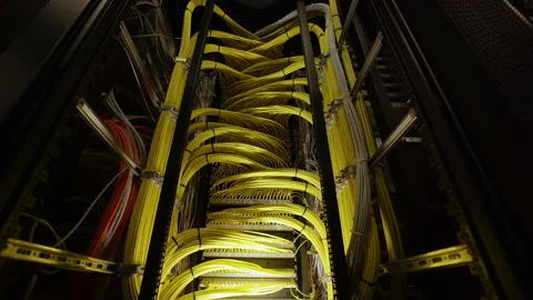 Top view of a large bundle of yellow wires in a large server room. Stock Footage 248783914