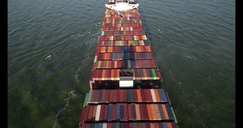 Top view of a large containership slowly entering a harbour Stock Footage 291590903