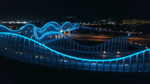 Top view of a large neon bridge in Asia. 4K cinematic aerial video Video stock 90190845