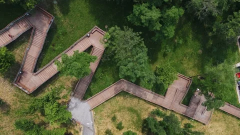 Top view of large pedestrian staircase with people in the park area of the city Stock Footage 156957722