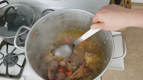 Top view of large pot of roasted Duck with other odds like Turkey gizzards Stock Footage 104251685