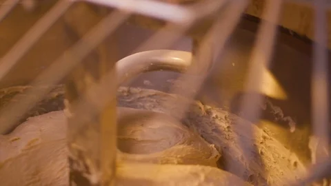 Top view of large stand machine used in commercial bakery to mix bread dough. Stock Footage 123649548