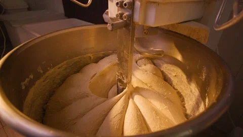 Top view of large stand machine used in commercial bakery to mix bread dough. Stock Footage 123649552