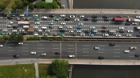 Top view, a large traffic jam formed on the bridge over the river. Stock Footage