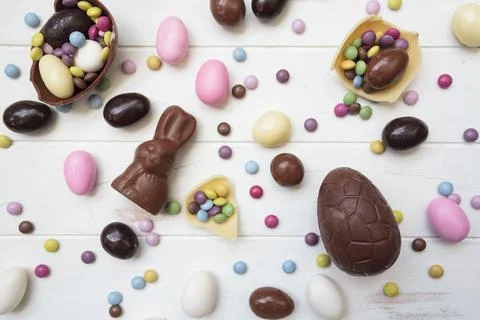 Top view of large variety of easter sweets, chocolate eggs, chocolate bunny,  Stock Photos