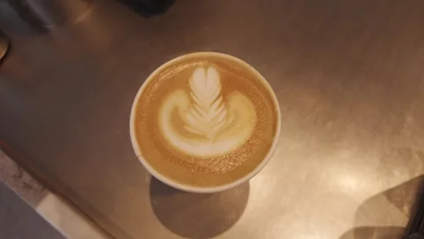 Top View Of Latte Art Coffee Served In Paper Cup At Cozy Cafe Stock Footage 342032355