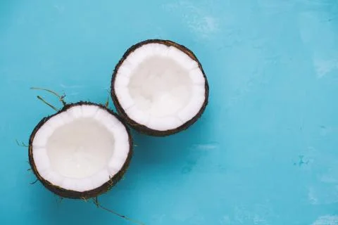 Top view layout of fresh coconuts on a blue background Stock Photos