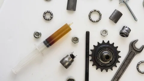 Top view of the layout of tools and parts of the rear hub of a bicycle wheel Stock Footage 117531075