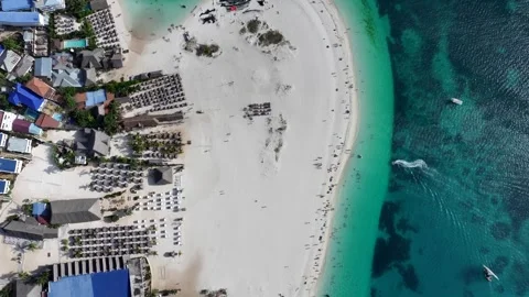 Top view with a lefthand 360° turn above the white sand beach in Kendwa Stock Footage 289063327