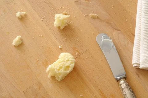Top view of leftover of snack with bread and butter Stock Photos